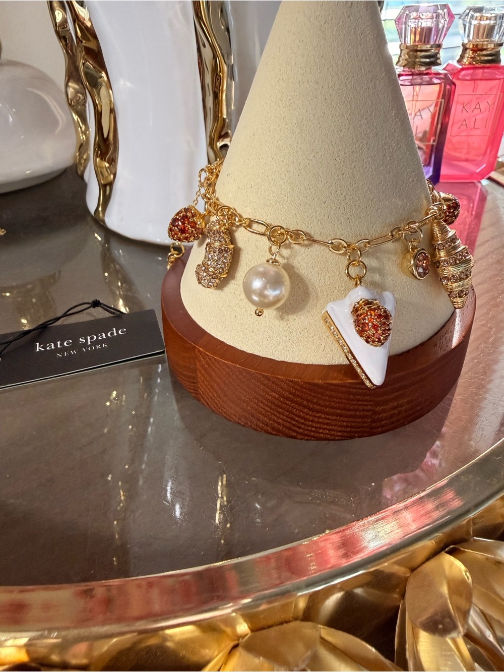 kate spade gold charm Sweets Bakery bracelet with enamel and pearl accents